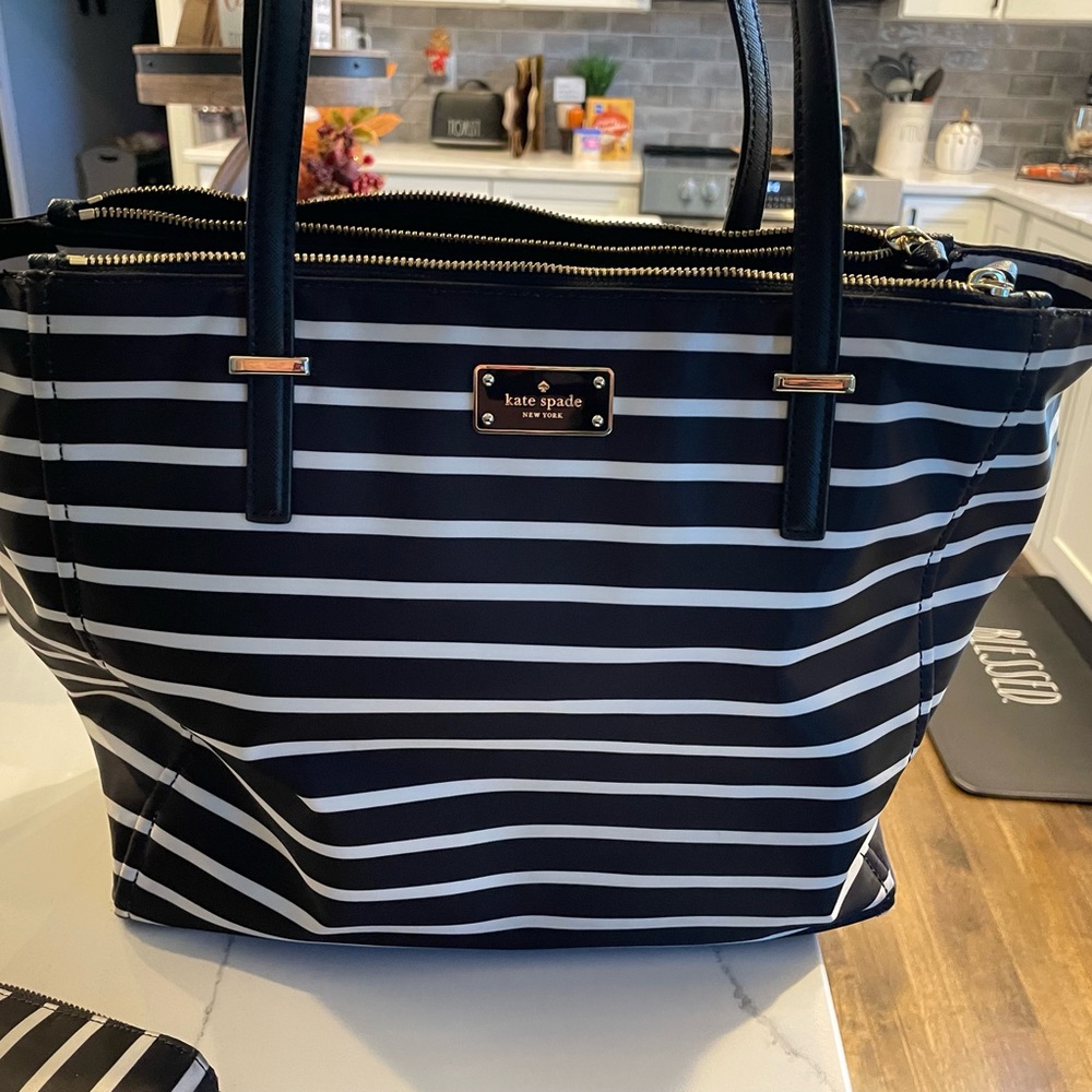 Kate Spade large purse with lots of pockets and a wallet with lots of pockets.